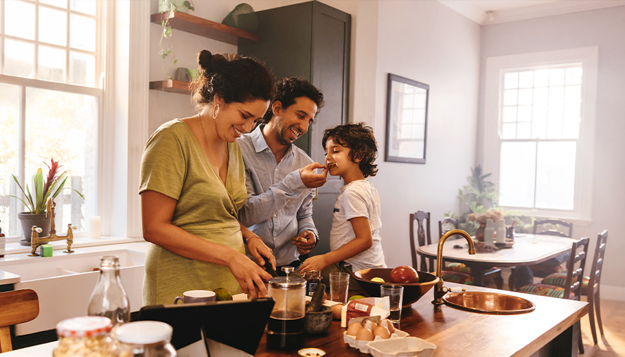 family making breakfast in kitchen 