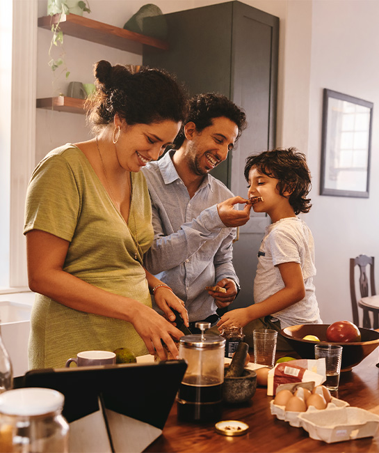 family making breakfast in kitchen