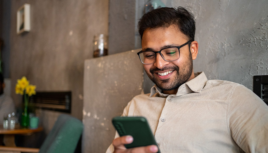 Man smiling at phone