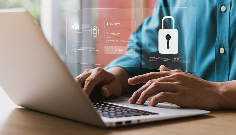 Man using his laptop with cybersecurity icons