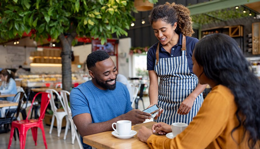 Man paying for food and drinks on a date